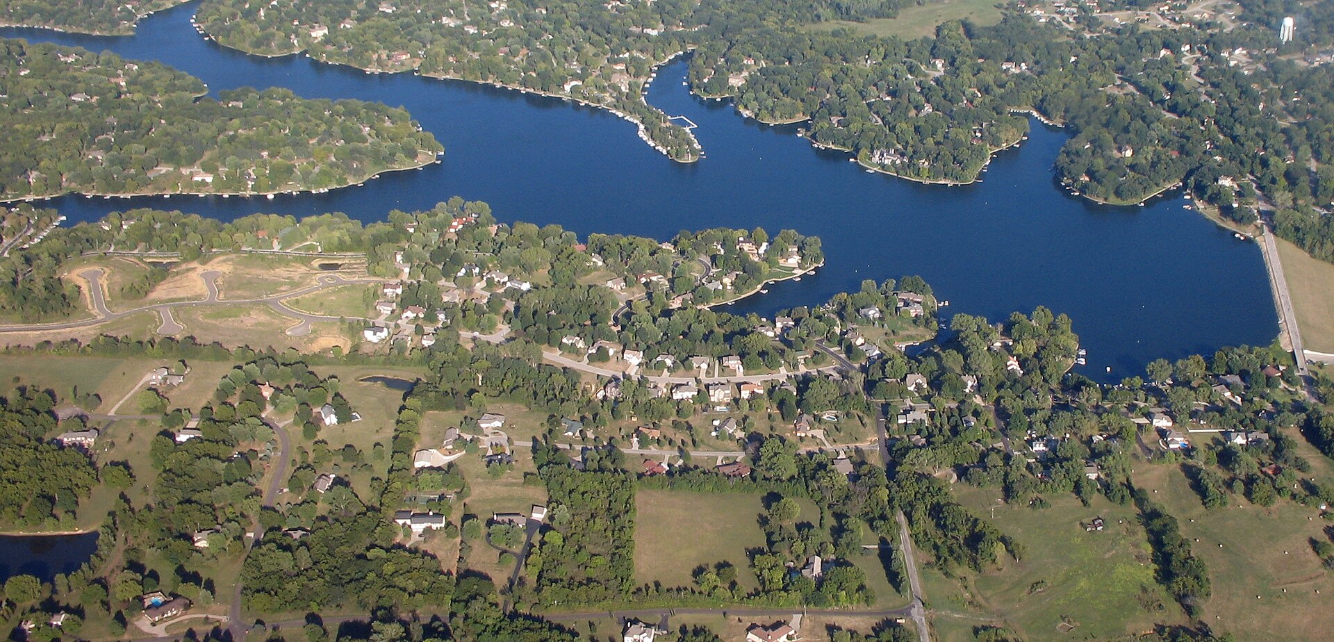 Weatherby Lake Missouri lakefront neighborhood with upscale homes and mature trees